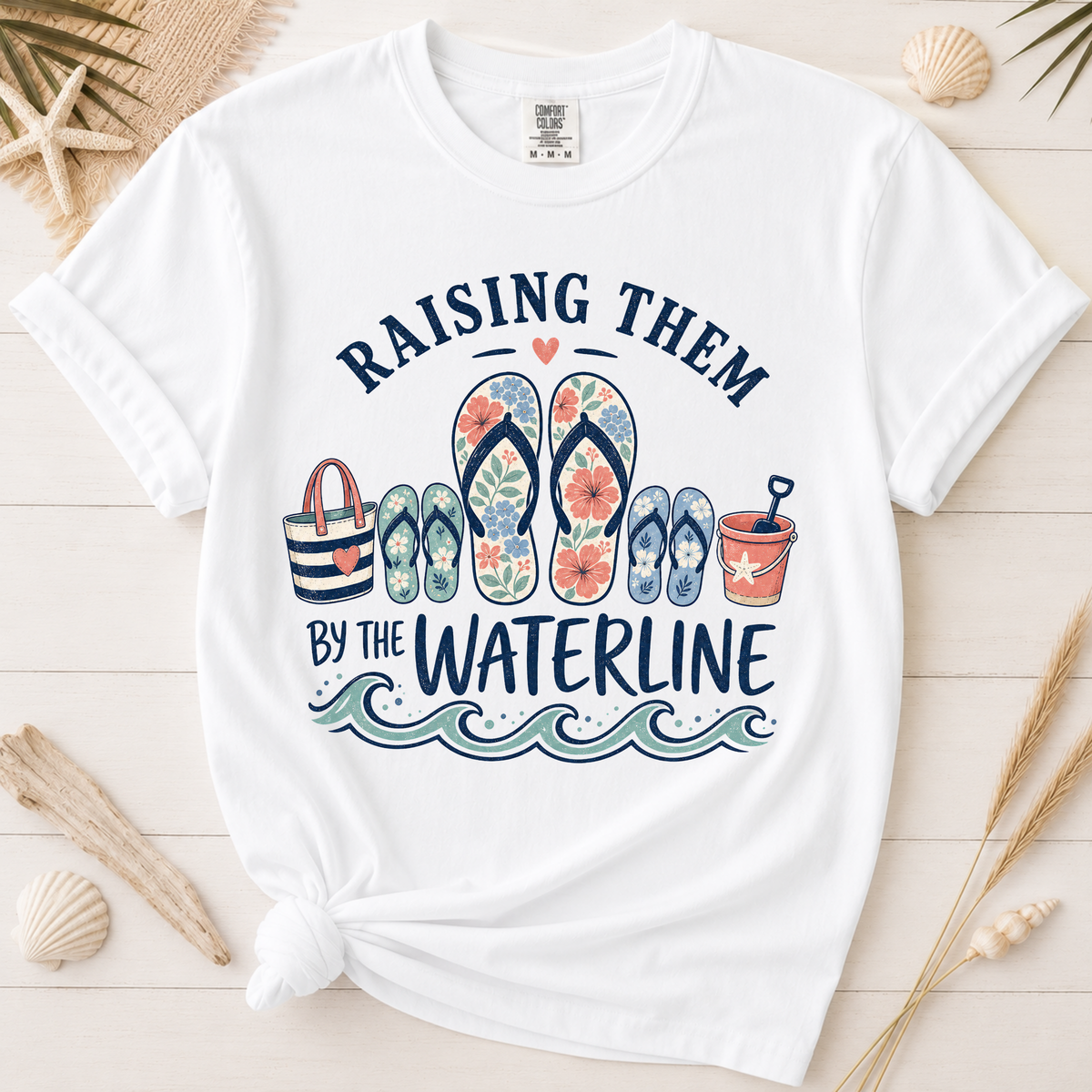 Raising Them by the Waterline Coastal Mom Graphic Tee
